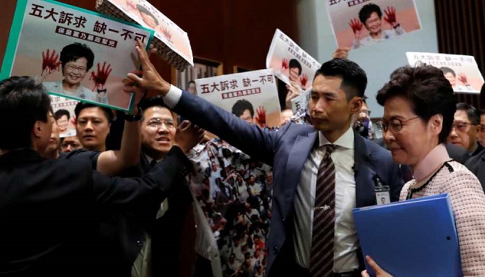 Hong Kong's leader Carrie Lam forced to suspend her annual address after protests