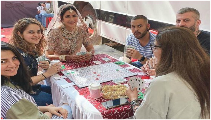 Katrina Kaif playing cards in bridal with team members