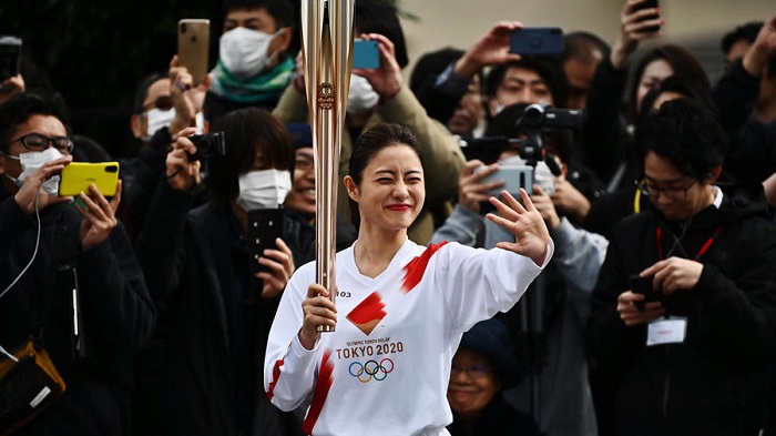 Tokyo holds Olympic torch rehearsal as spectre of coronavirus looms