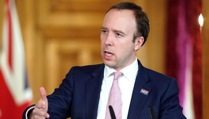 UK warns of tougher social distancing measures