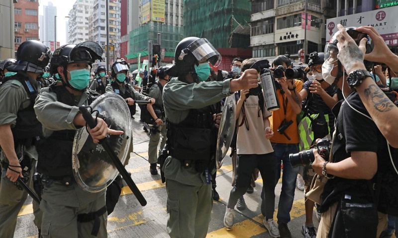 Hong Kong police use pepper spray to clear May Day protest