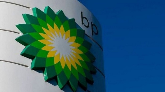 BP halves dividend after suffering huge losses
