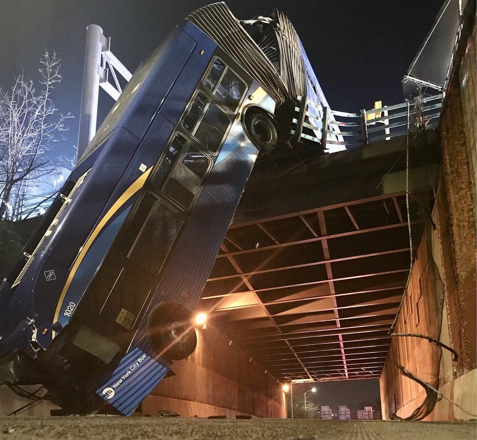 NYC bendy bus left drooping from overpass in Bronx