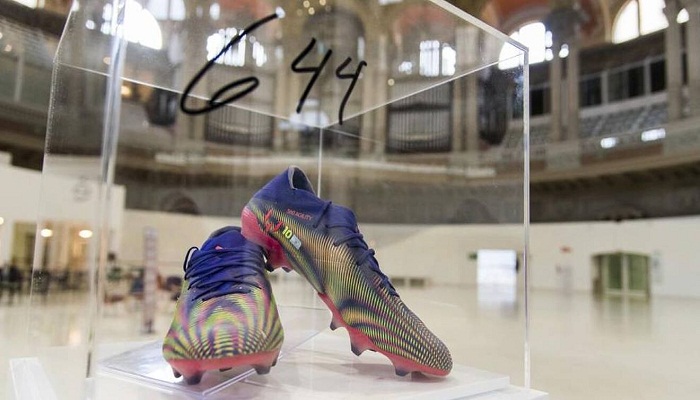 Lionel Messi's record-breaking boots to be auctioned for charity