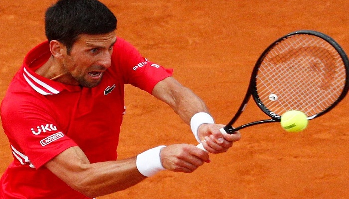 Djokovic battles to victory as he warms up for French Open