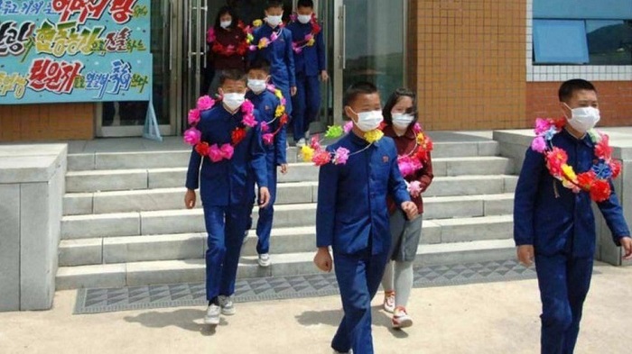 North Korea says children volunteering on mines and farms