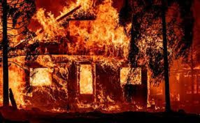 Firefighters battle California blaze generating its own climate

