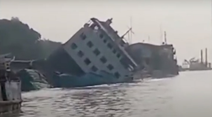 Ferry tilts with goods-laden trucks at Paturia dock (Updated)