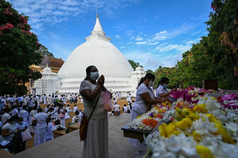 Crisis-hit Sri Lanka lifts curfew for Buddhist festival
