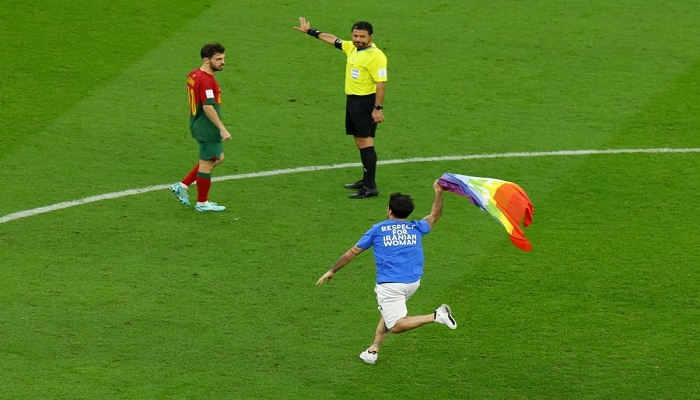 Man with rainbow flag invades pitch during World Cup match