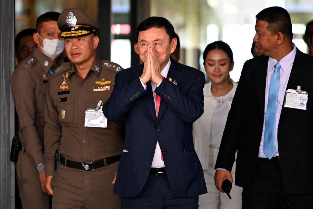 Ex-PM Thaksin returns to Thailand after 15 years in exile