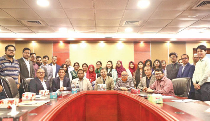 Researchers from different institutions pose for a photograph with guests at the concluding ceremony of a 4-day training programme at the auditorium of North South University (NSU) in the capital on Sunday.