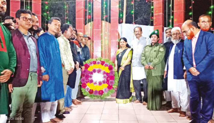 Officials of the Kuliarchar upazila administration pay tributes to the Language Movement martyrs by placing wreaths at Upazila Shaheed Minar in Kishoreganj on Wednesday. -Daily Sun Photo