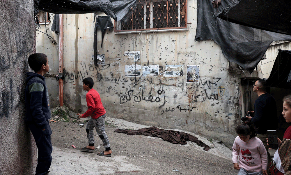 Israel bombs Gaza, fights Hamas around hospitals