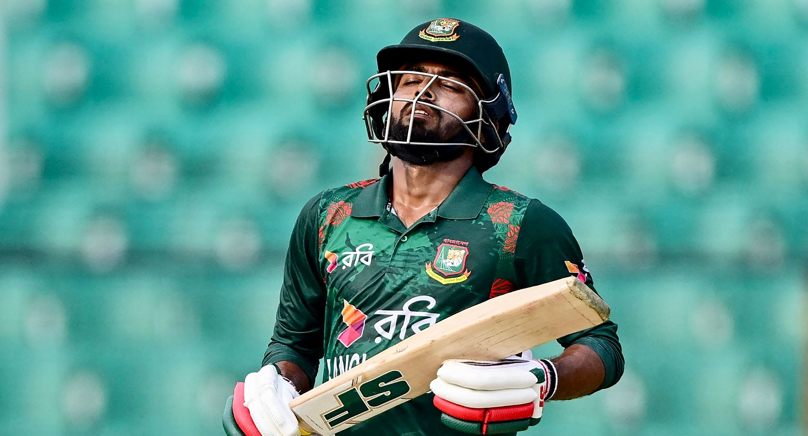 Towhid fifty powers Bangladesh to 165-5