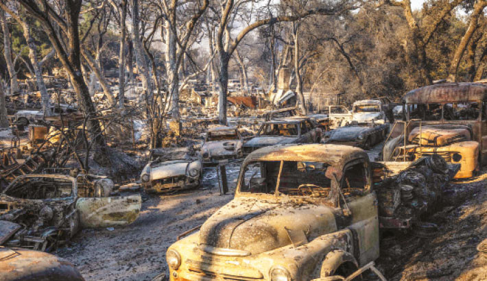 Los Angeles wildfire explodes, engulfing homes