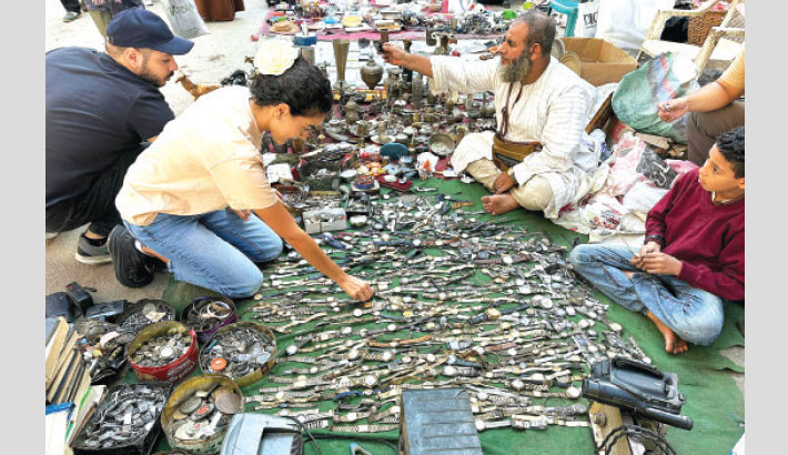 An Egyptian street vendor displays watches for sale at the Saturday market in downtown Cairo on 5 October.  Photo: AFP