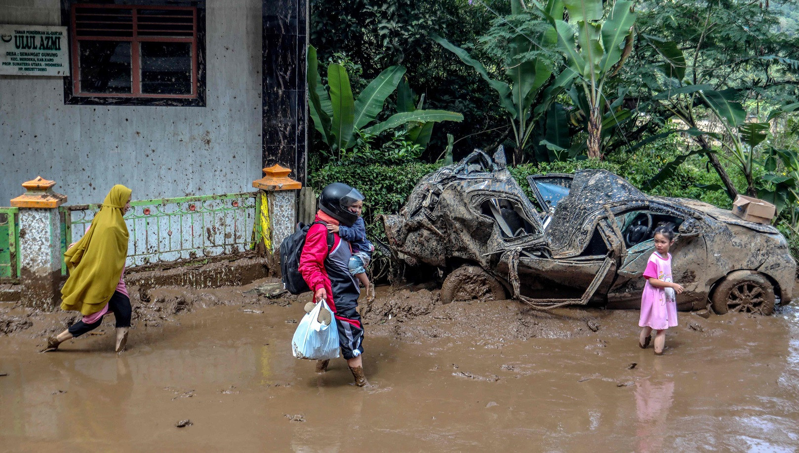 Indonesia digs out as flooding, landslide death toll hits 20