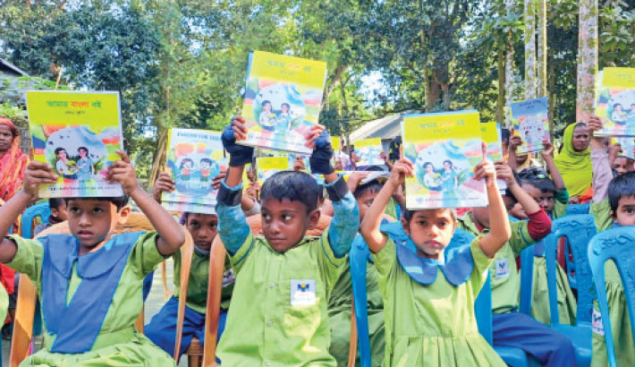 New textbooks bring smiles to kids of Bashundhara Shuvosangho School