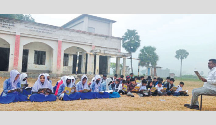 Students forced to attend classes under open sky amid freezing winter