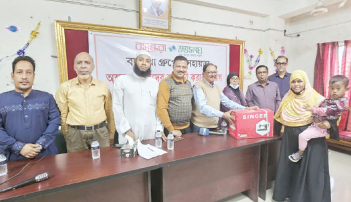 15 families get free sewing machines 
in Bhola