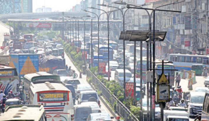 Heavy traffic chokes city roads on Sunday despite a shutdown announced by the Awami League. The photo was captured in Banani, Dhaka. -NAZMUL ISLAM