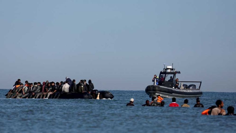 Britain to review rights laws in asylum policy overhaul