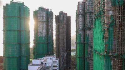 Hong Kong mourns victims of apartment blaze that killed 128 and counting