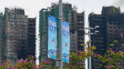 Hong Kong election under pressure after deadly fire