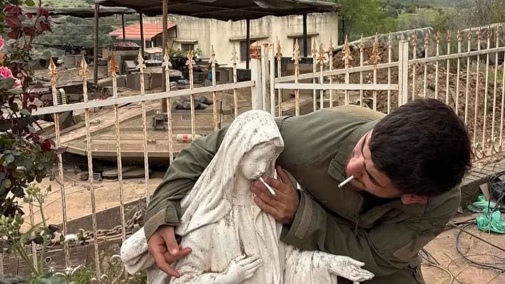 Israeli soldier desecrating Virgin Mary statue in Lebanon