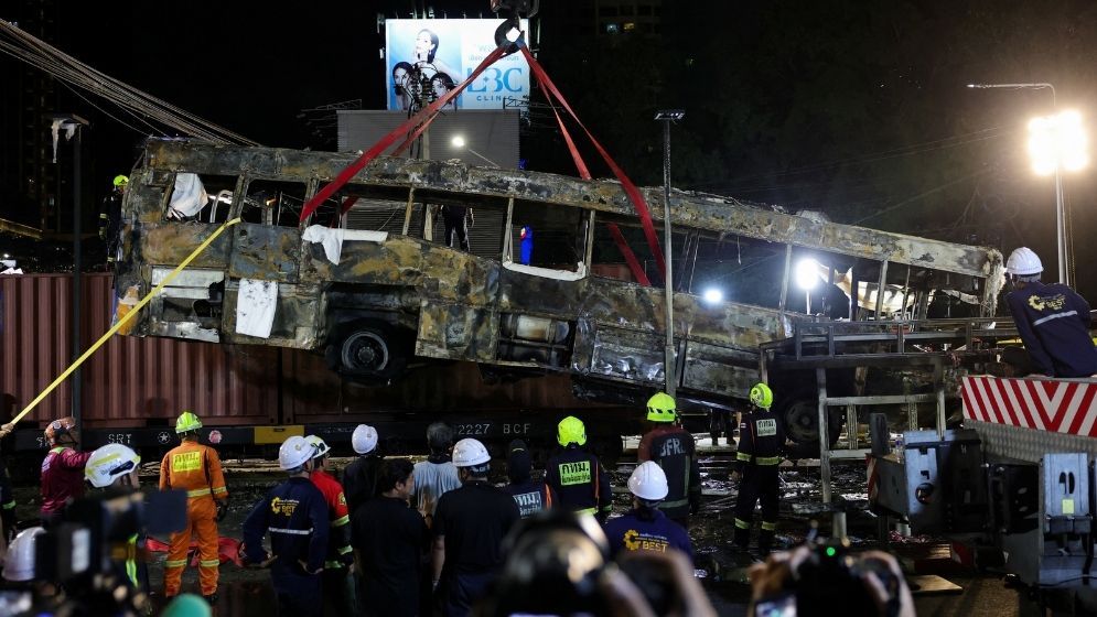 Eight killed in Bangkok as freight train hits bus