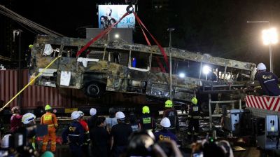 Eight killed in Bangkok as freight train hits bus