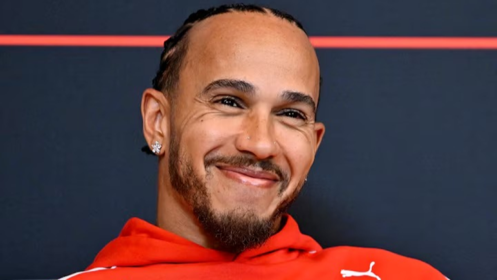 Hamilton sheds tear over Arsenal title as drivers swap lap times for football talk