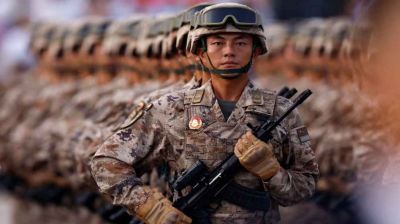 Japan rejects 'new militarism', accuses China of rapidly arming