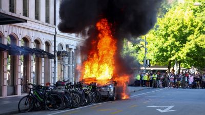 Protesters set Tesla ablaze, smash UN office's windows in Geneva anti-G7 march