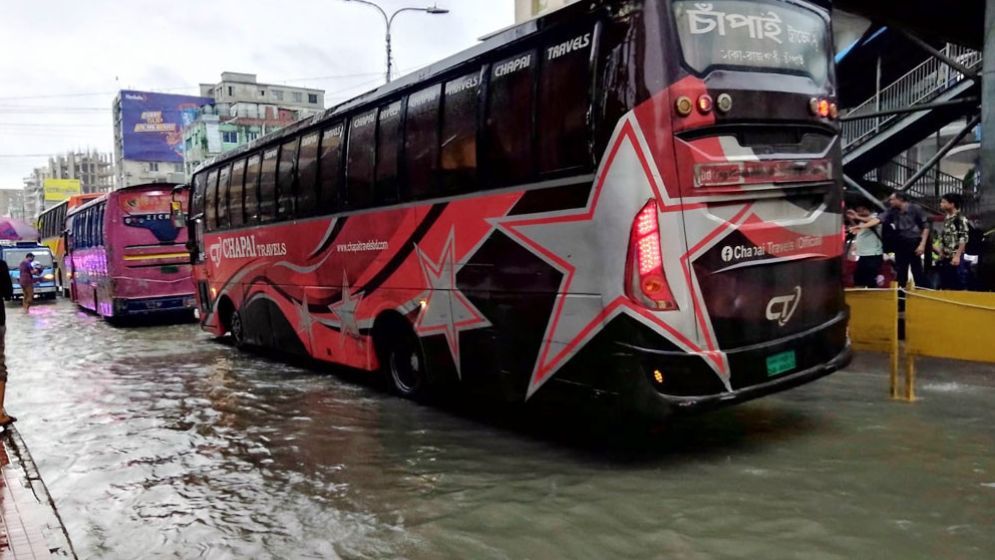 Heavy rain since dawn causes waterlogging, misery in Dhaka