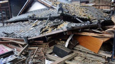 Rescuers search for survivors after powerful Japan earthquake kills 13