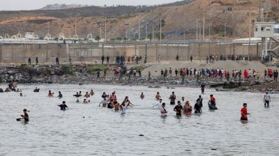 Spain says huge surge across border into enclave has reversed, half of migrants go back