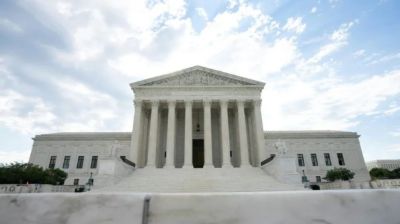 Top court upholds Trump bid to curb mail-in ballots for now