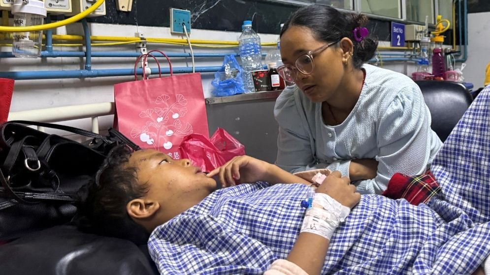 Mother reunited with 8-year-old who climbed trees to survive Nepal floods