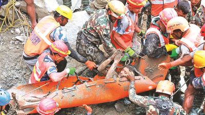 Rescuers pull 2 trapped workers from a hydropower tunnel 9 days after Nepal floods