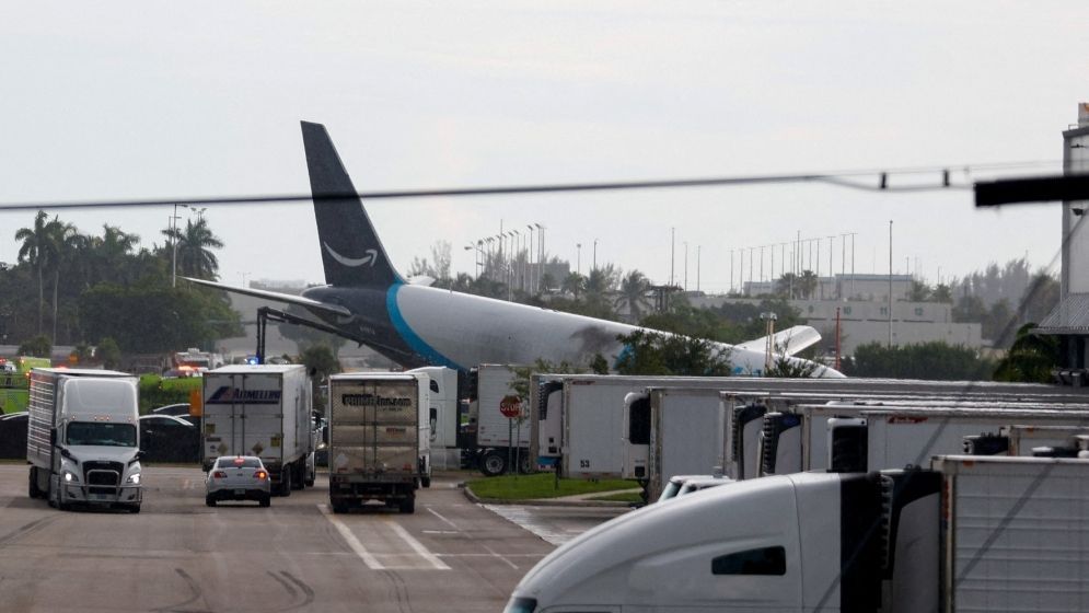 Amazon cargo plane overshoots Miami runway, hits vehicles, catches fire