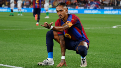 Flick sets record as Barcelona breeze past Racing with Raphinha hat-trick