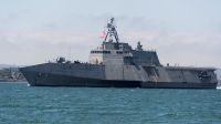 China sends naval forces to monitor US warship near disputed shoal