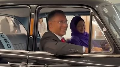 PM sits in Toyota’s first passenger car during factory visit