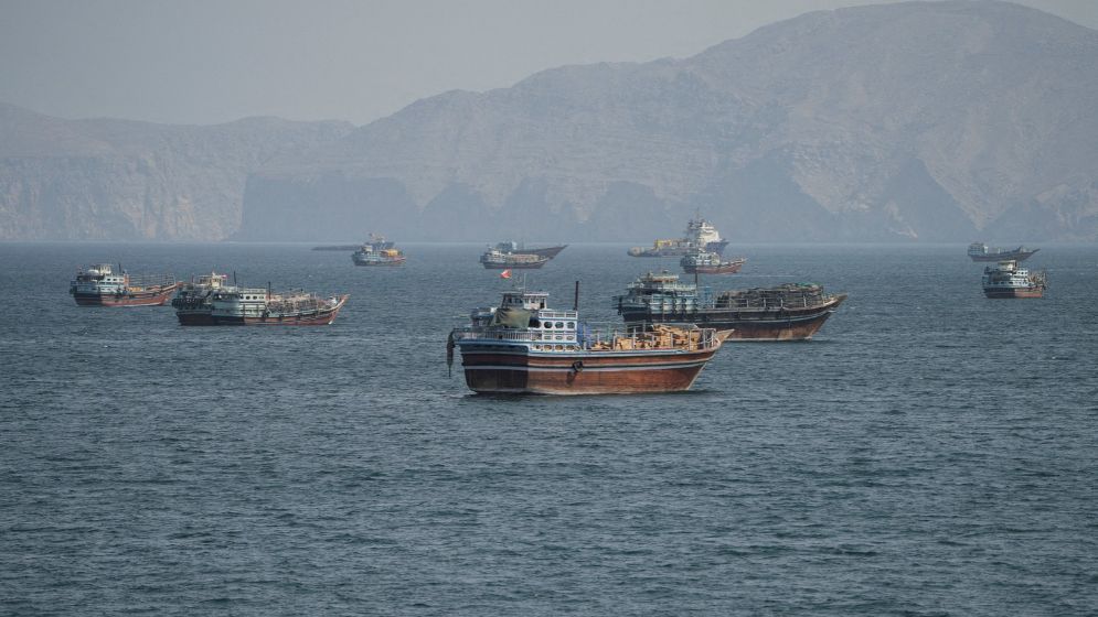 Oman rescues 25 from burning ship, Iran halts tankers